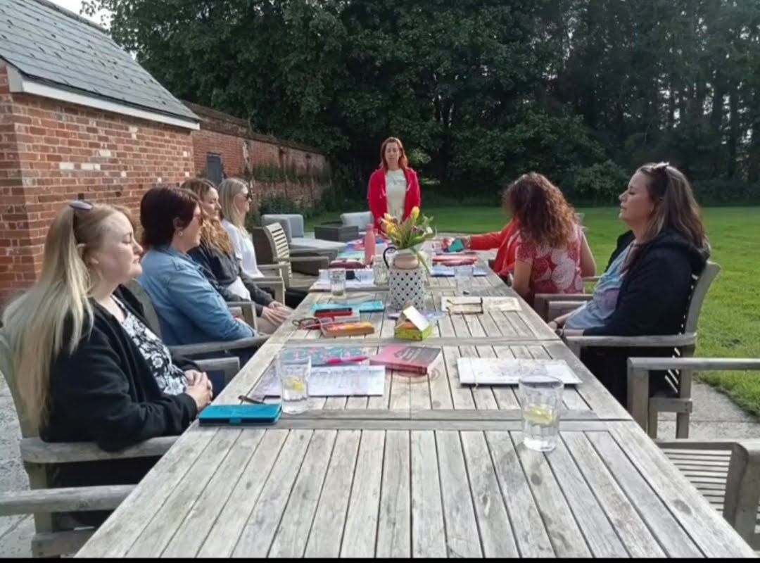 Elaine Leading a Heal Your Life meditation in the garden at ladies retreat weekend